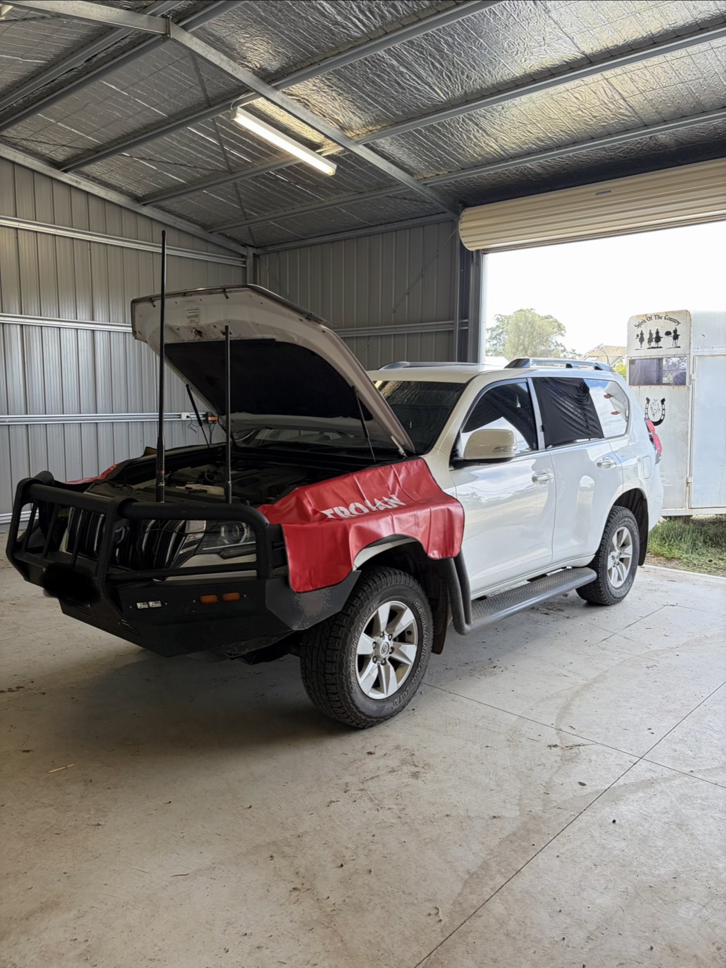 On-site service on a Toyota Prado in a farm shed